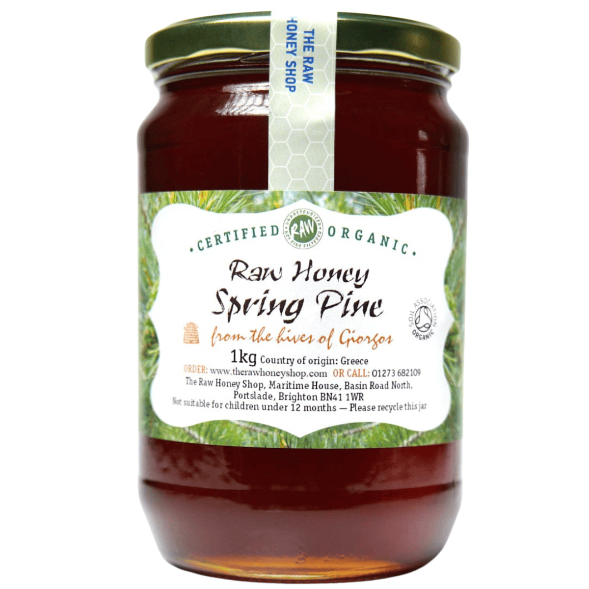 Caramel coloured honey in glass jar with white label to the front