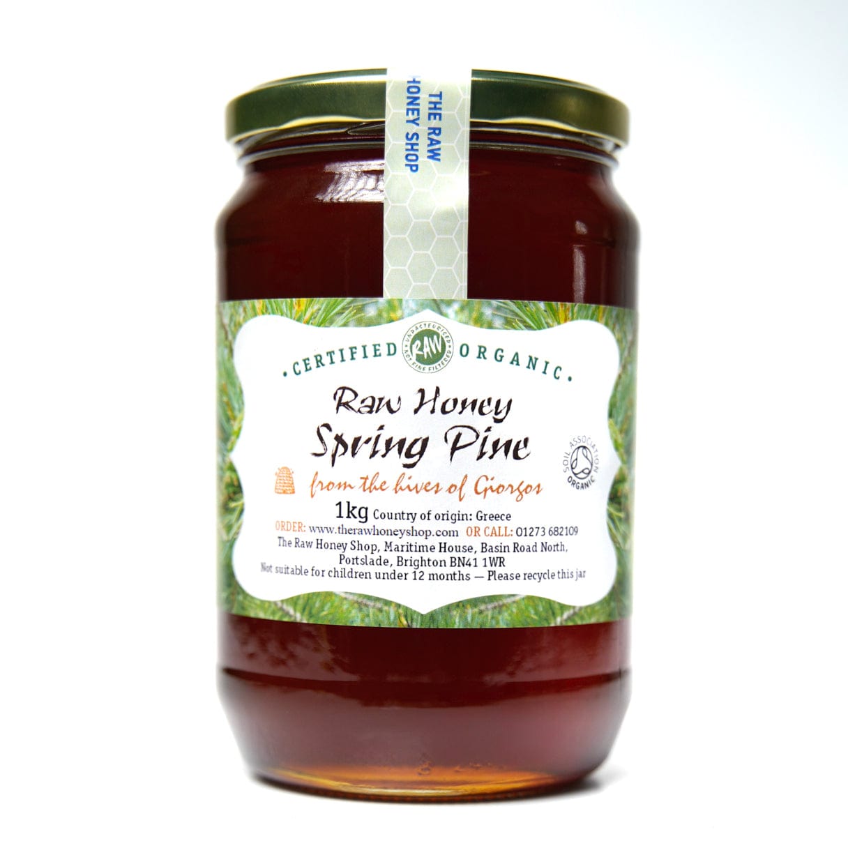 Large labelled glass jar containing 1kg of dark raw organic spring pine honey.