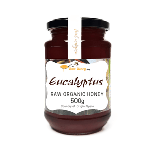 A 500g glass jar of Antonios Raw Organic Eucalyptus Honey from The Raw Honey Shop. 