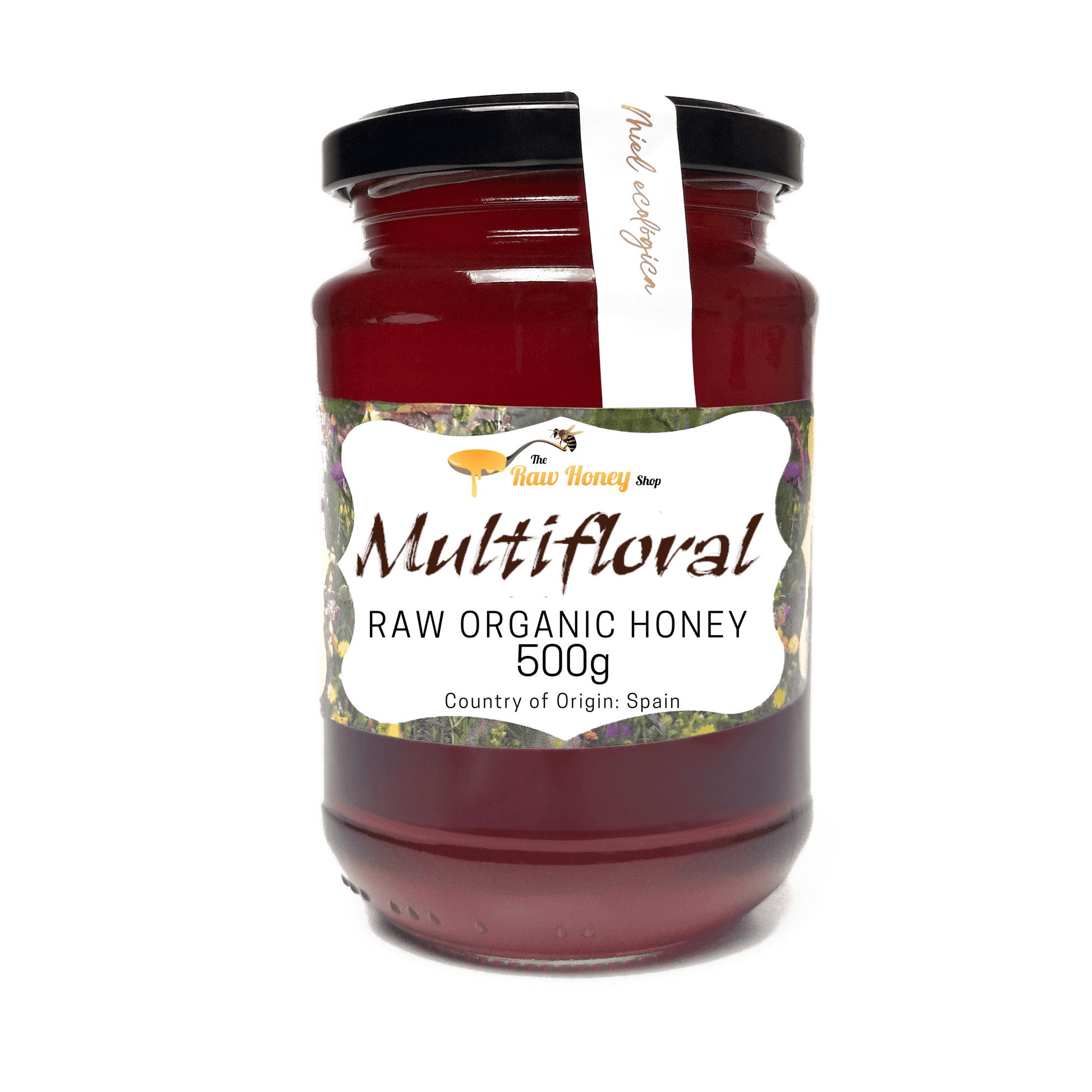 A 500g glass jar of Antonios Raw Multifloral Raw Organic Honey, featuring a white label with floral accents and a black lid, set against a plain white background.
