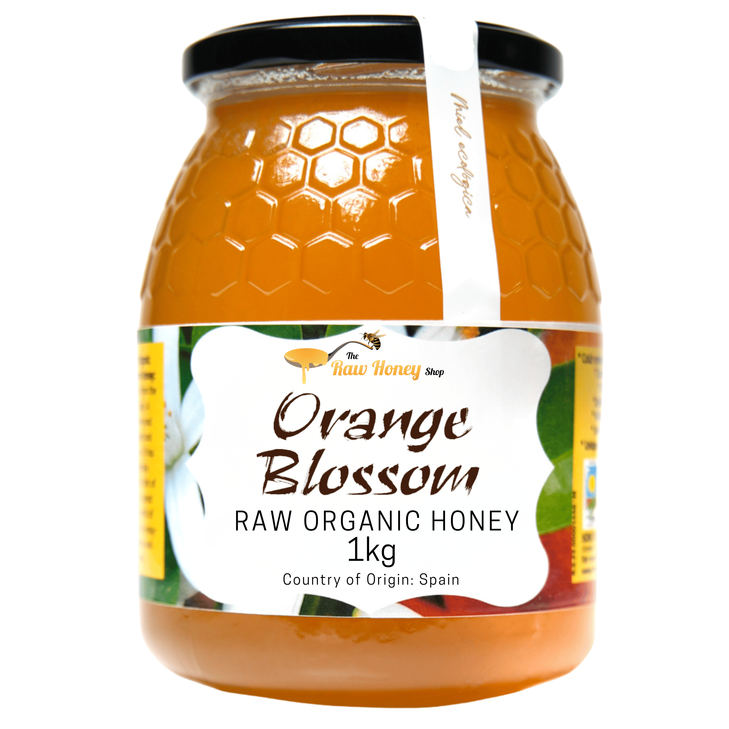 A 1kg glass jar of The Raw Honey Shop's Antonio Orange Blossom Raw Organic Honey, featuring a black lid and a white label with orange and green accents, set against a plain white background.