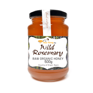 A 500g glass jar of Antonios Raw Organic Wild Rosemary Honey from The Raw Honey Shop.