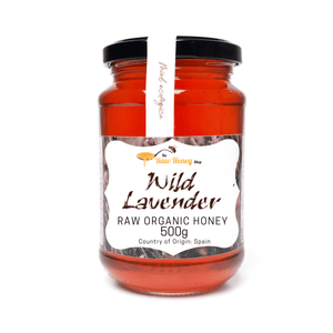 A 500g glass jar of Antonios Raw Organic Wild Lavender Honey from The Raw Honey Shop.