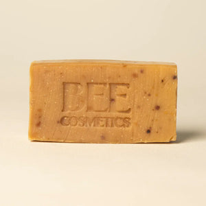Bar of 'Bee Cosmetics' soap with stamped branding.