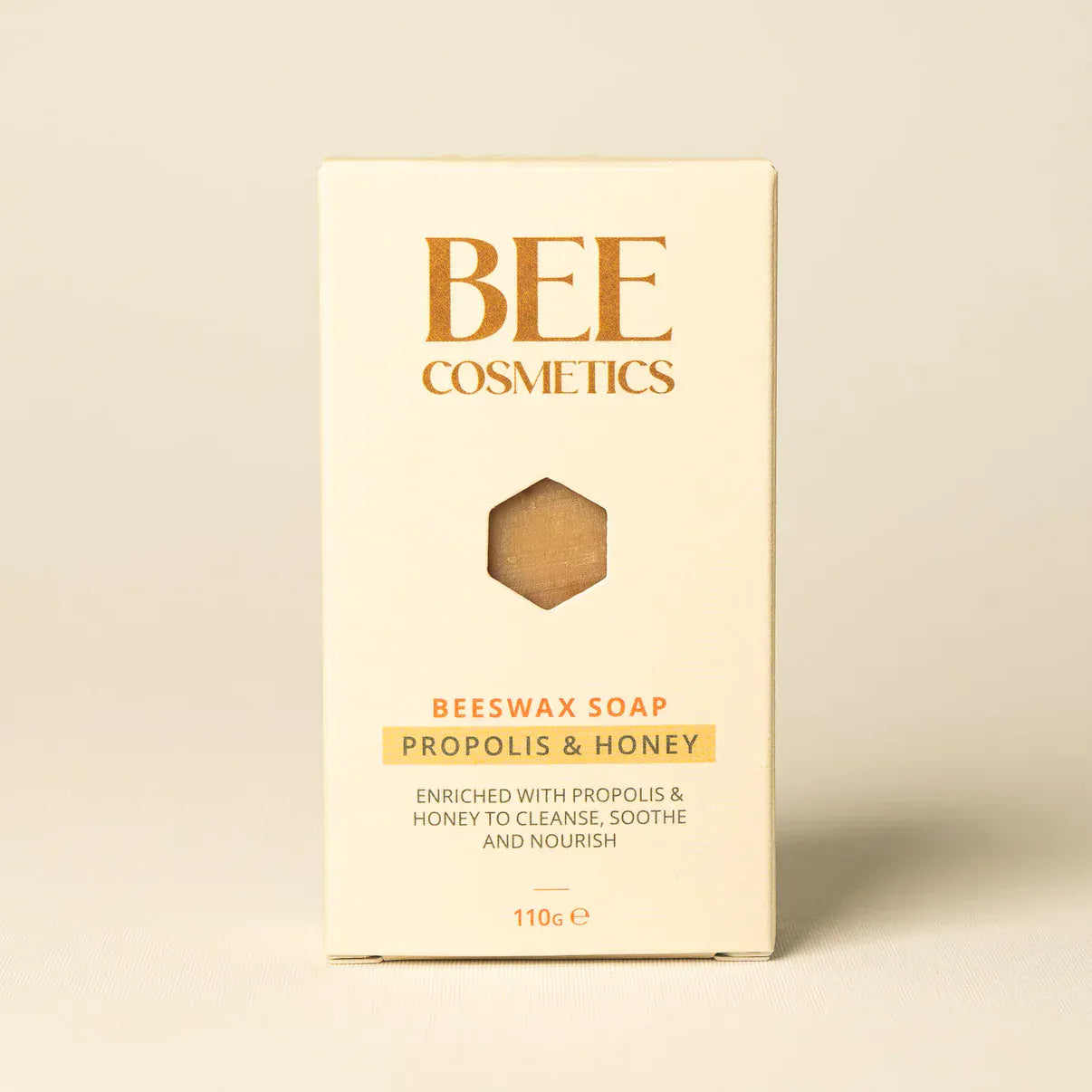 Cardboard box packaging containing a bar of Bee Cosmetics beeswax soap.