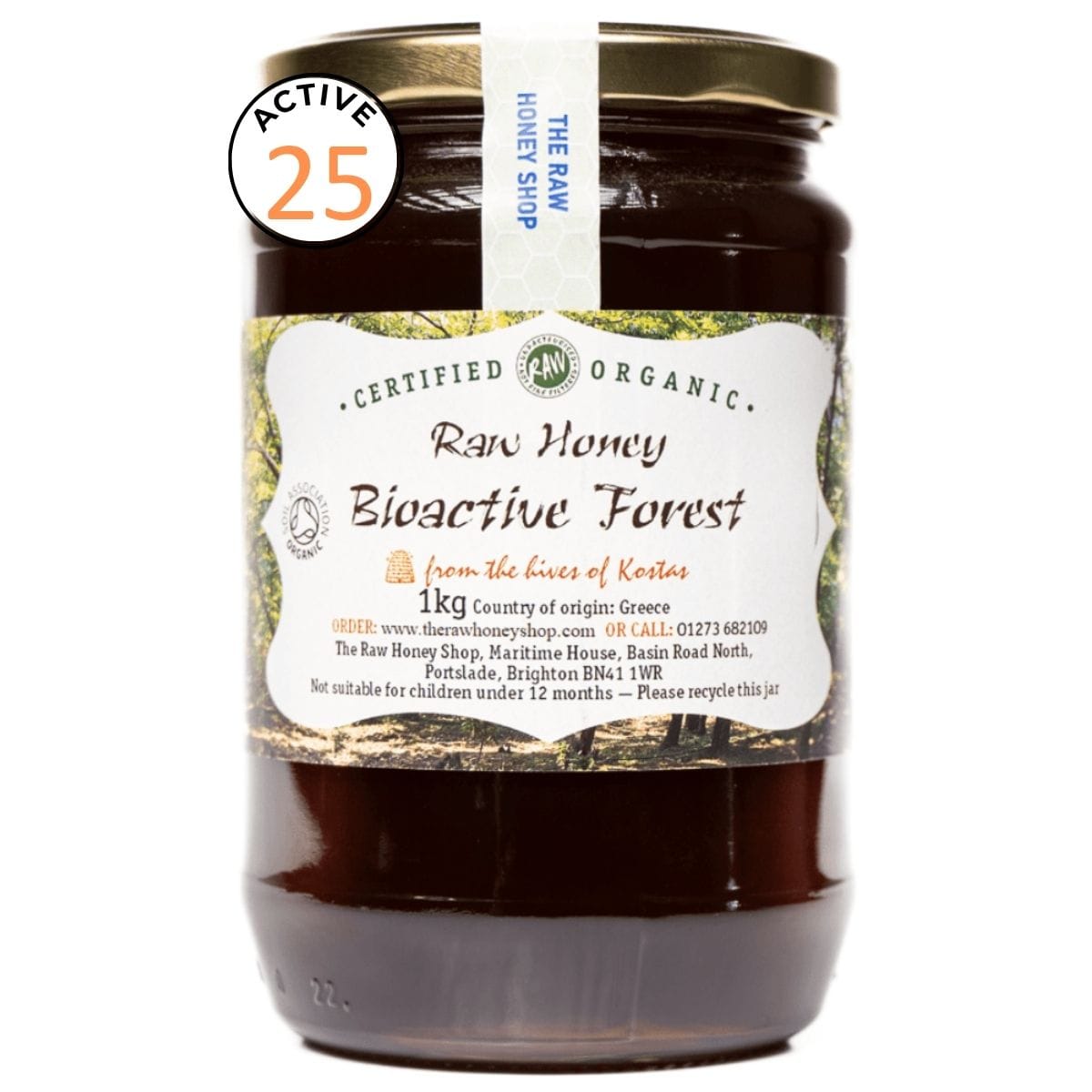 Jar of raw honey with a label on a white background