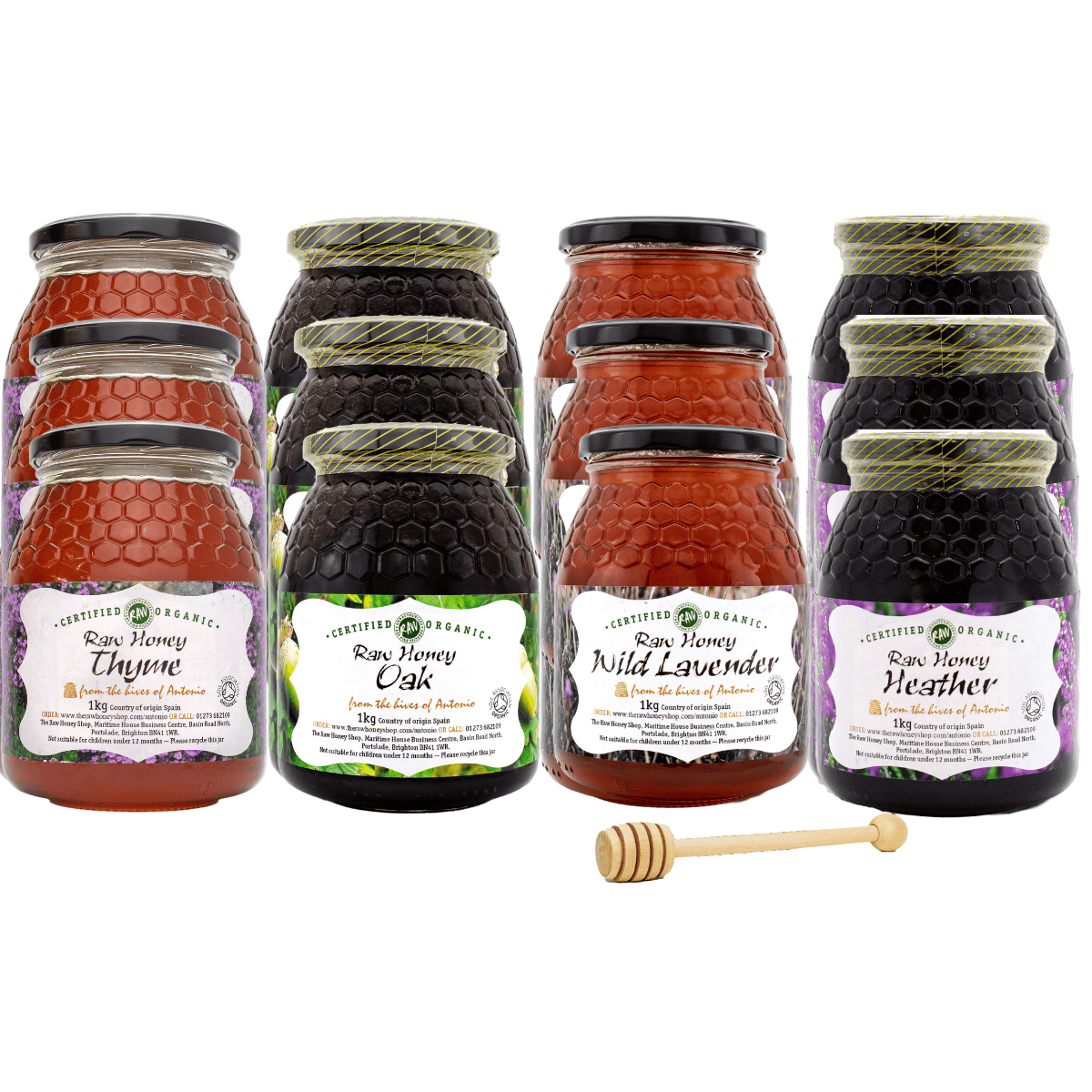 Set of honey jars with labels and a honey dipper on a white background