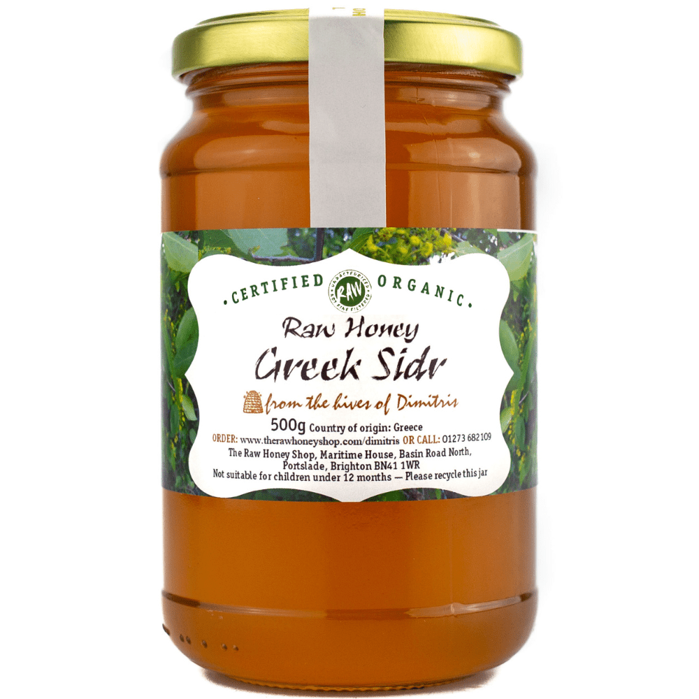 glass jar containing 500g of golden raw organic Greek sidr honey.