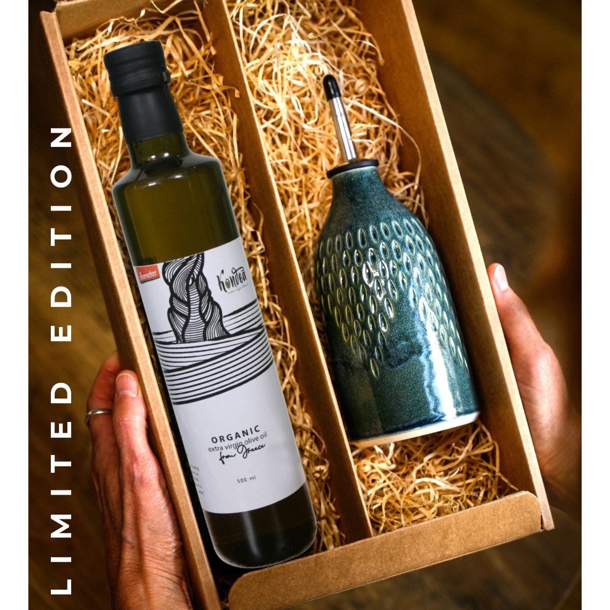Two bottles in a box labeled 'Limited Edition' with one being organic olive oil.