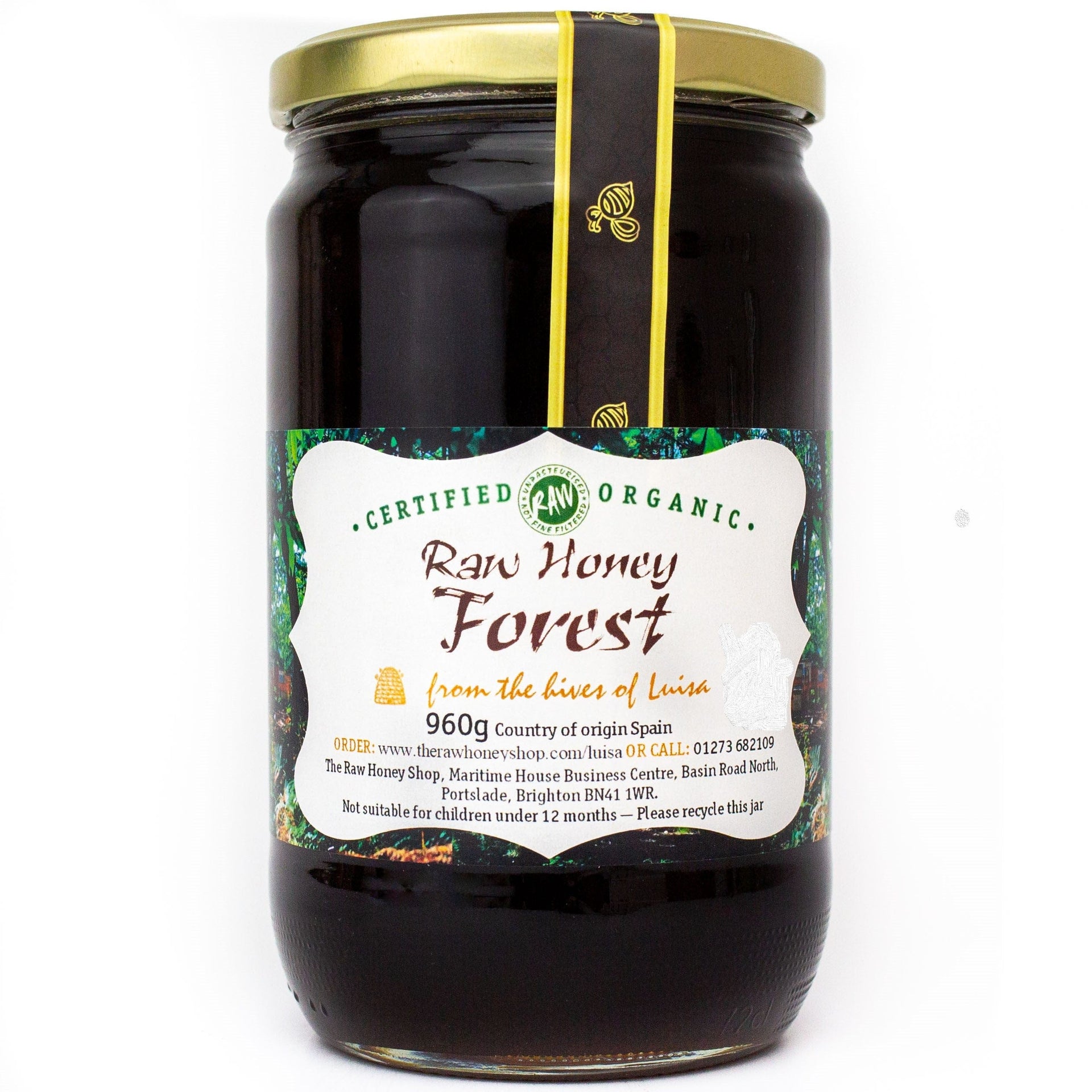 Large labelled glass jar containing 960g of dark raw organic forest honey