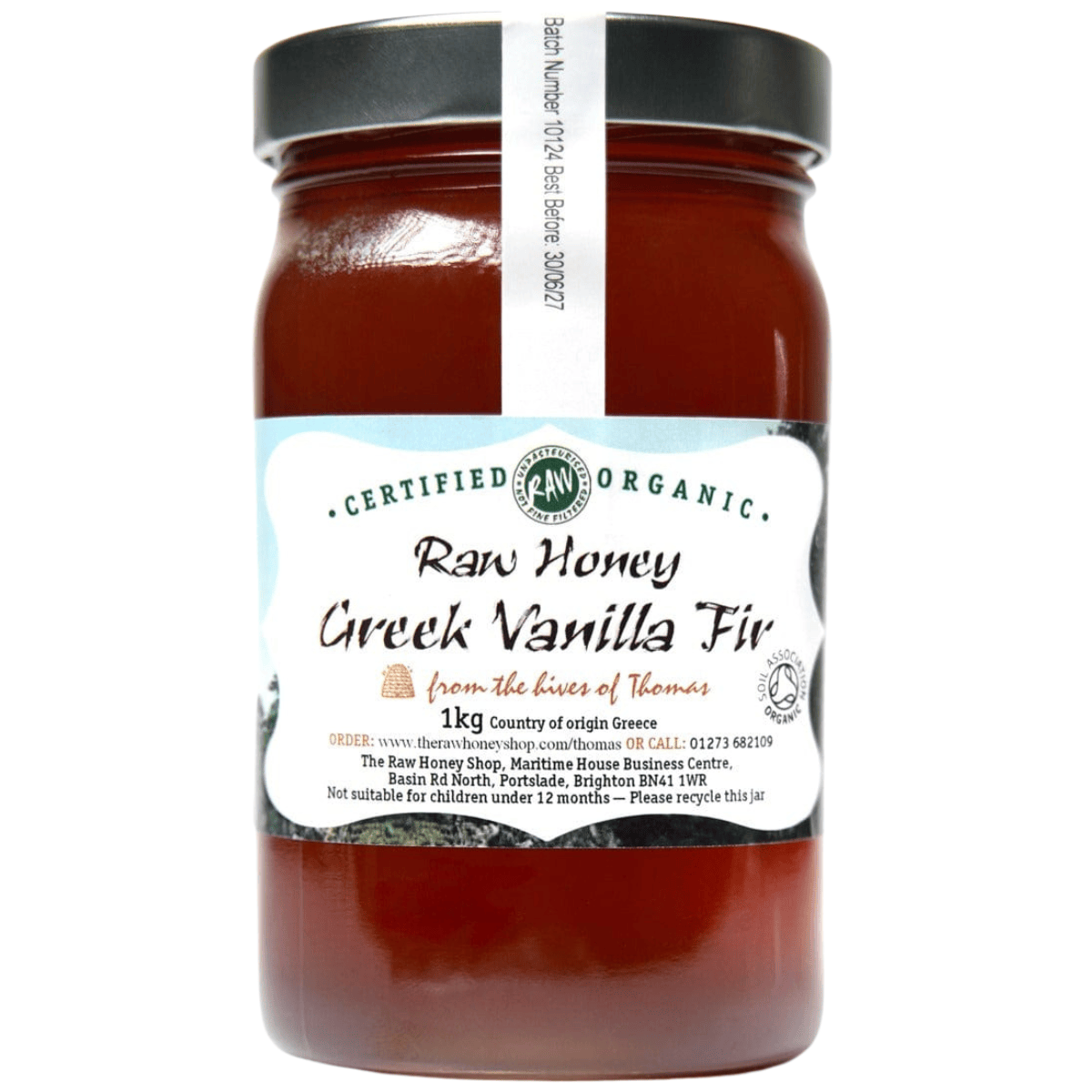 Caramel coloured honey in glass jar with white label to the front of the jar.