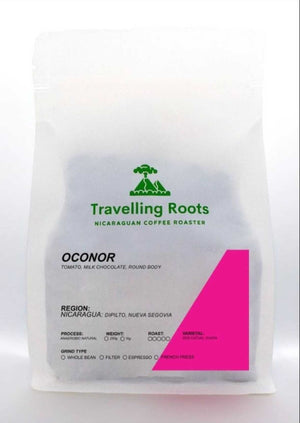 Coffee package with 'Travelling Roots' branding on a white background