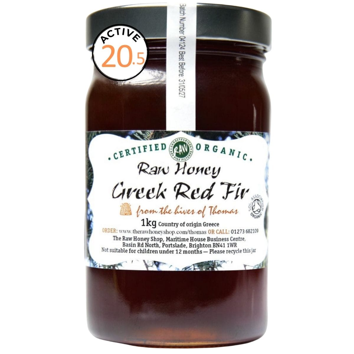 Jar of brown honey with white label to the front