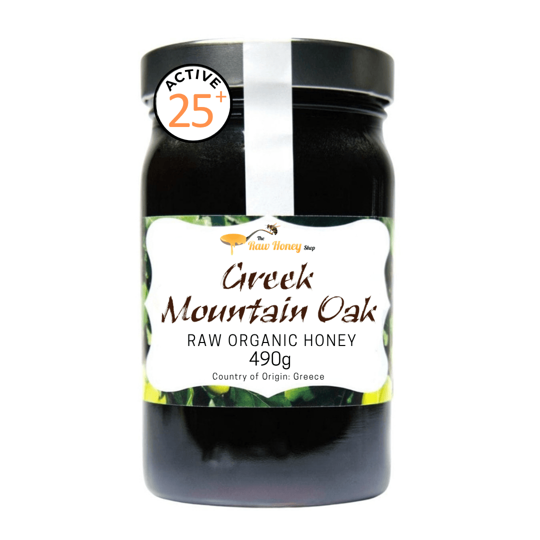 A jar of Native Honey Greek Mountain Oak Raw Organic Honey, 490g, with a black lid and a white label featuring green accents, set against a plain white background.