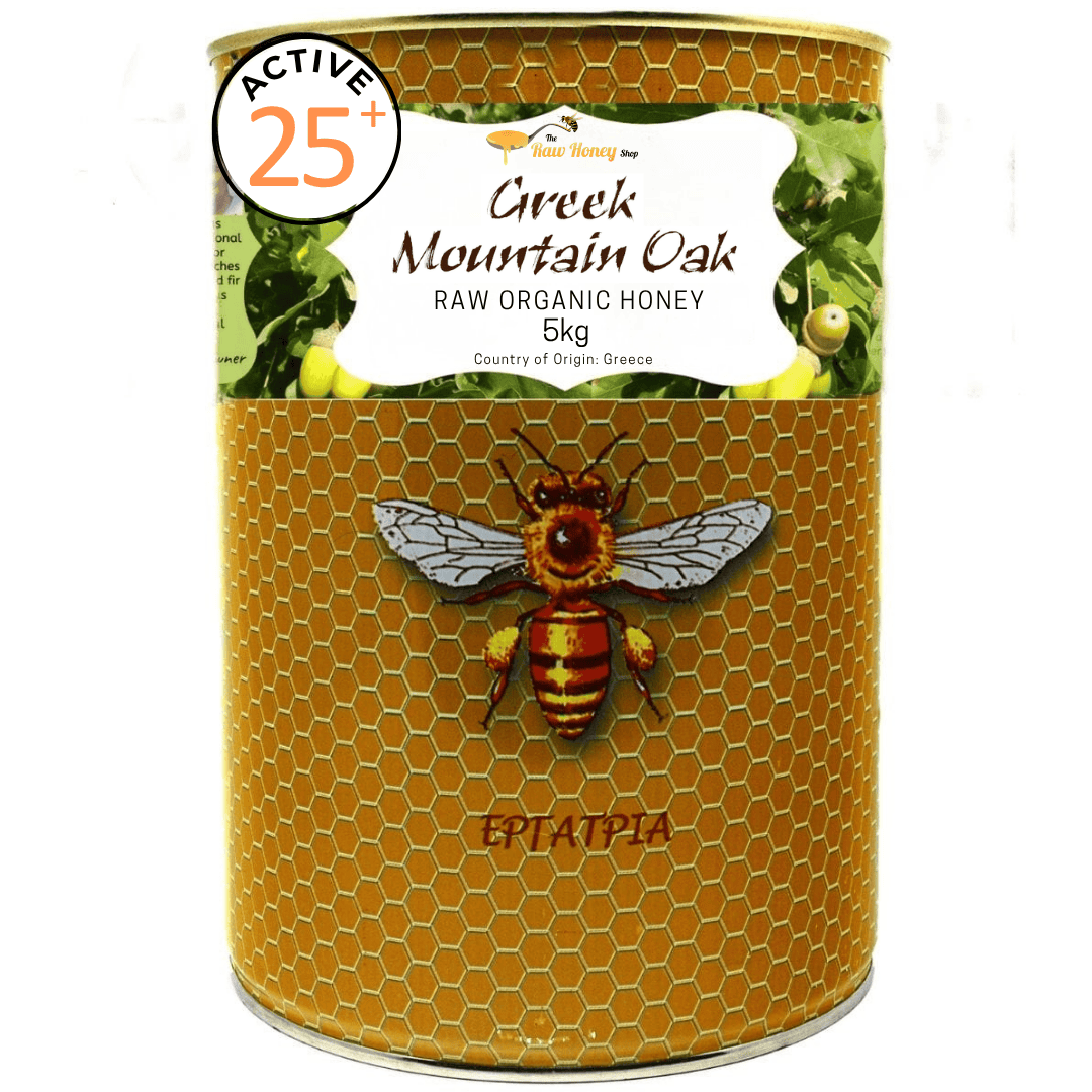 A 5kg metal tin of Epiatpia Greek Mountain Oak Raw Organic Honey, featuring a golden honeycomb pattern, a central illustration of a bee, and a white label at the top.