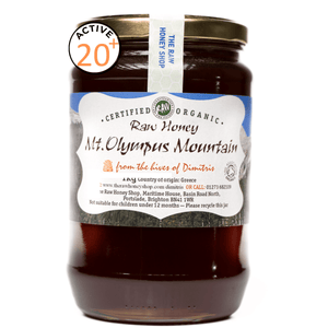 Jar of honey with white label to the front