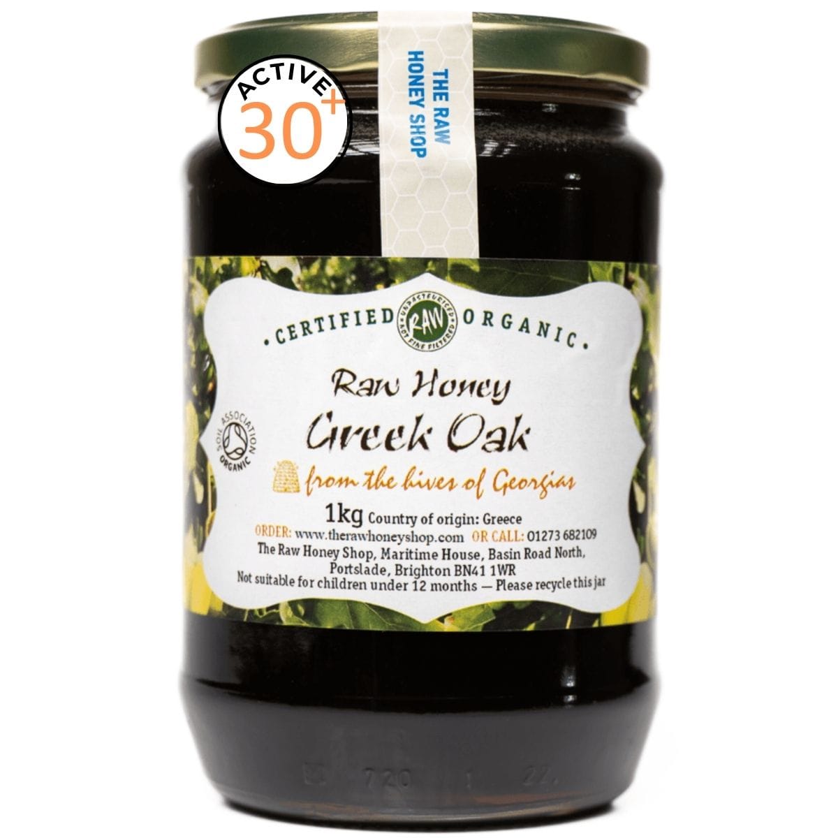 Jar of raw honey labeled 'Certified Organic Raw Honey Greek Oak' on a white background