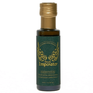 Bottle of Greek Imperator olive oil with a green label and gold cap on a white background
