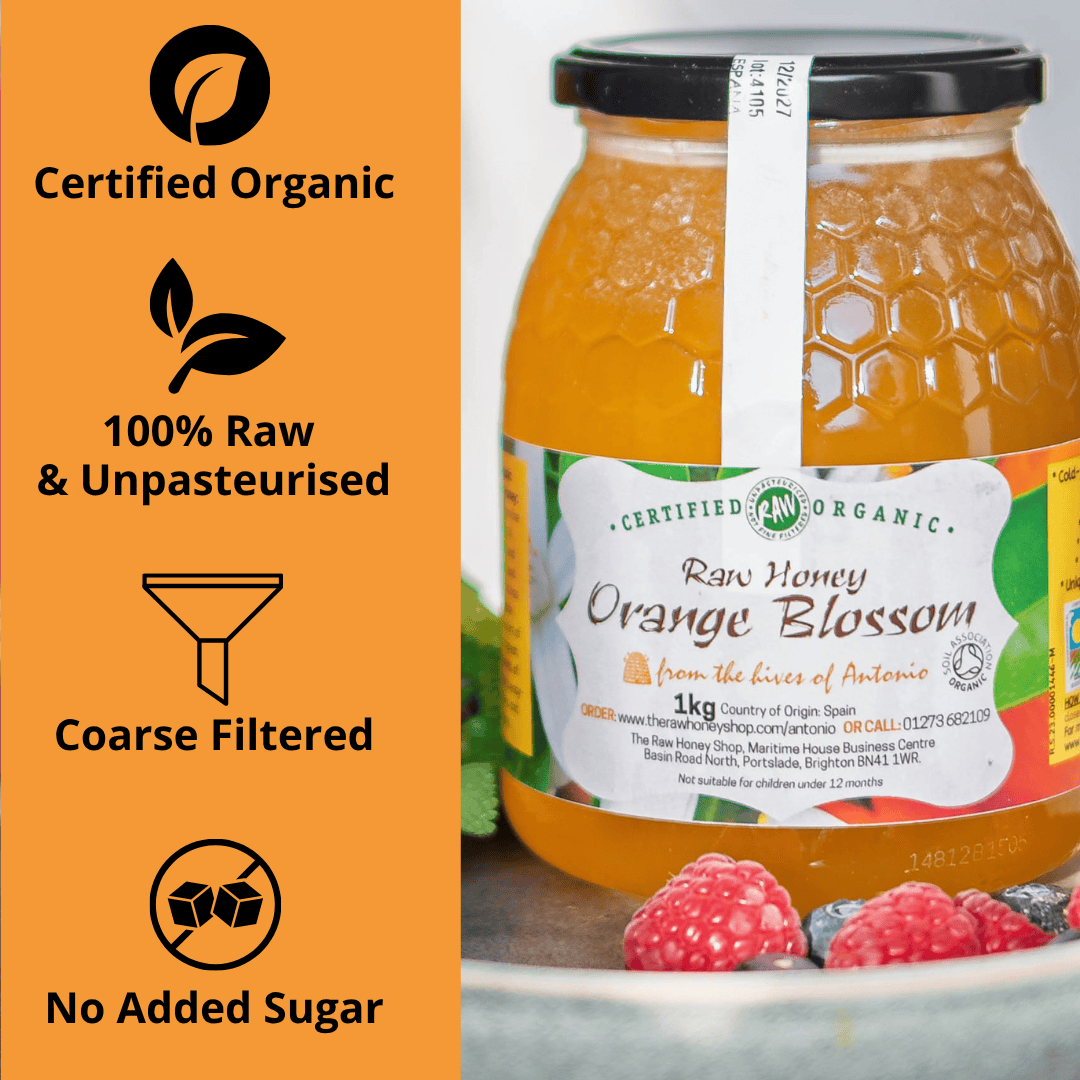 A jar of Certified Organic Raw Honey Orange Blossom honey shown next to an orange informational panel highlighting 'Certified Organic', '100% Raw & Unpasteurised', 'Coarse Filtered', and 'No Added Sugar'.