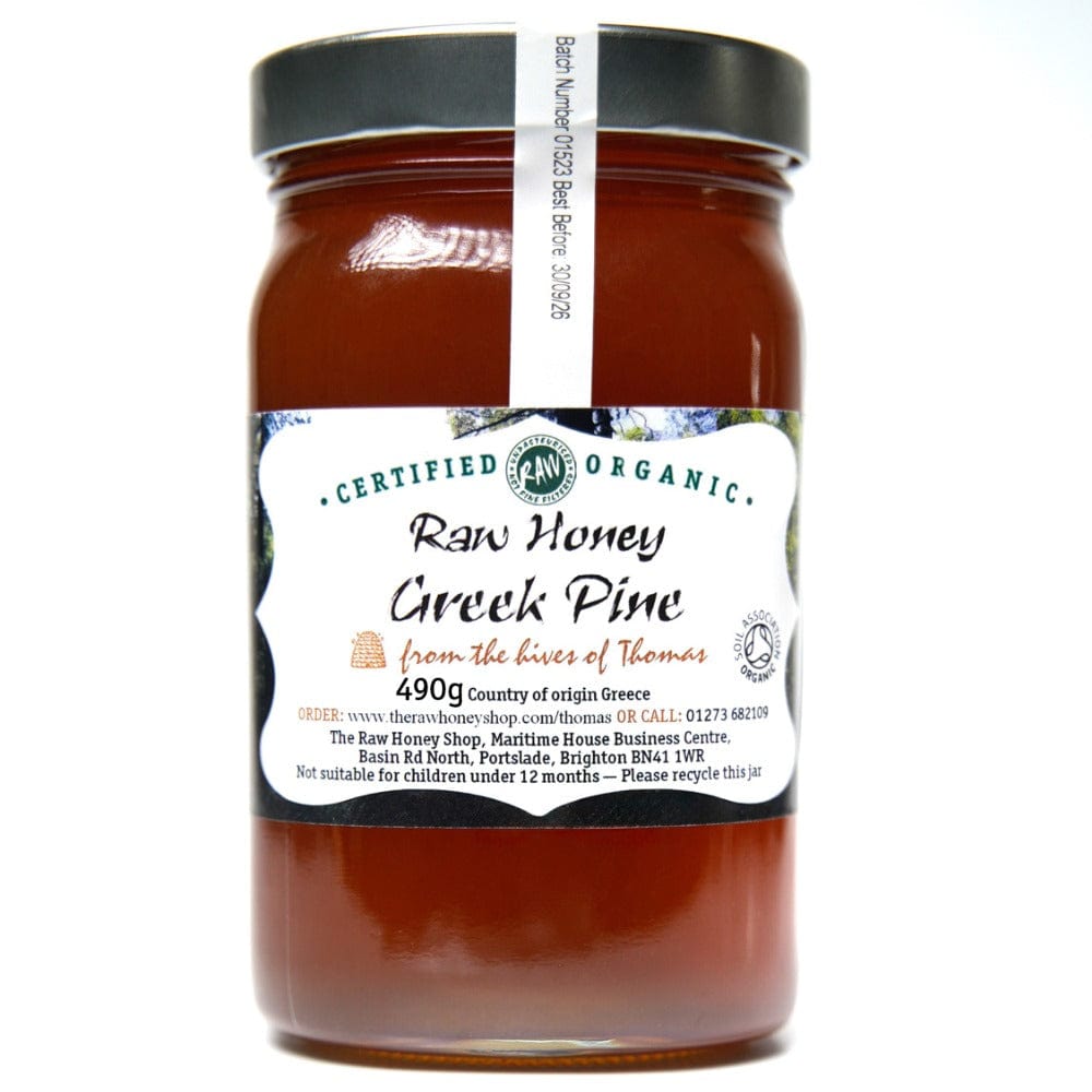 Labelled glass jar containing 490g of dark raw organic Greek pinel honey