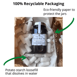 A jar of Greek Red Fig honey surrounded by white potato starch packing material inside a box, with text callouts about recyclable packaging and dissolvable filler.