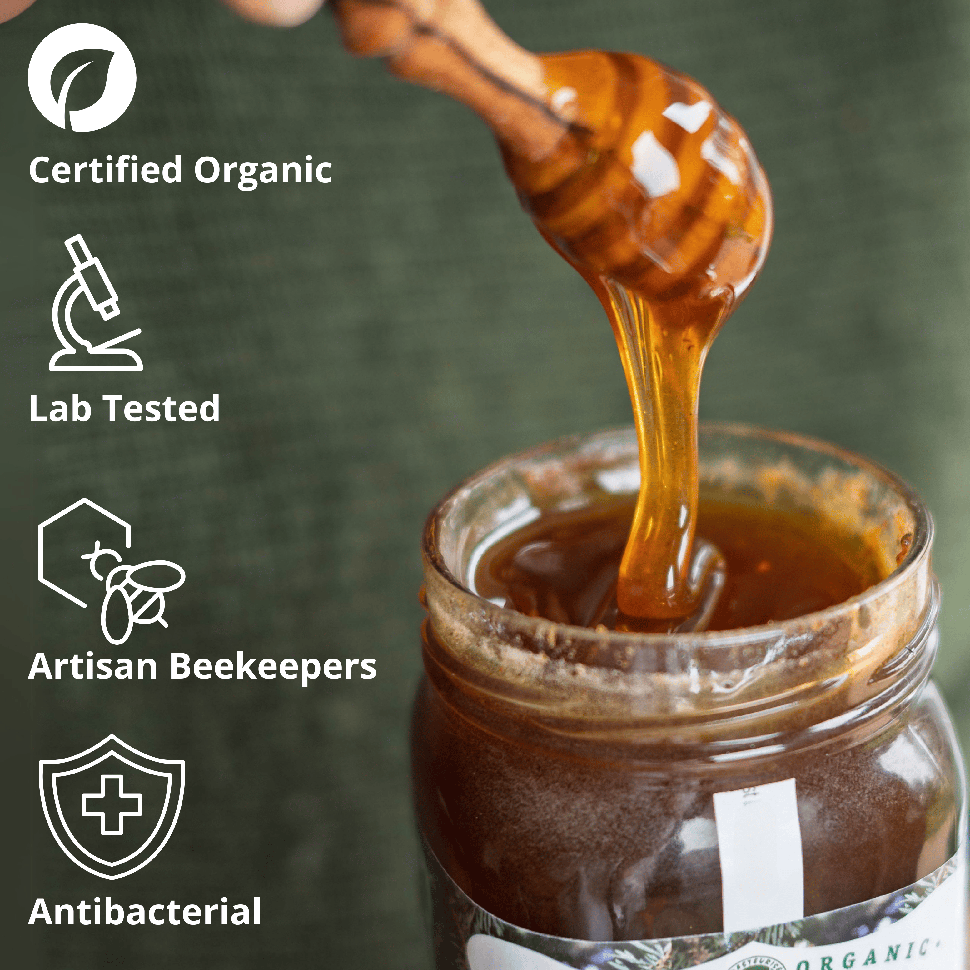 A jar of honey with a wooden honey dipper dripping thick amber honey into the jar, set against a dark green textured background. White text and icons on the left read 'Certified Organic', 'Lab Tested', 'Artisan Beekeepers', and 'Antibacterial'.
