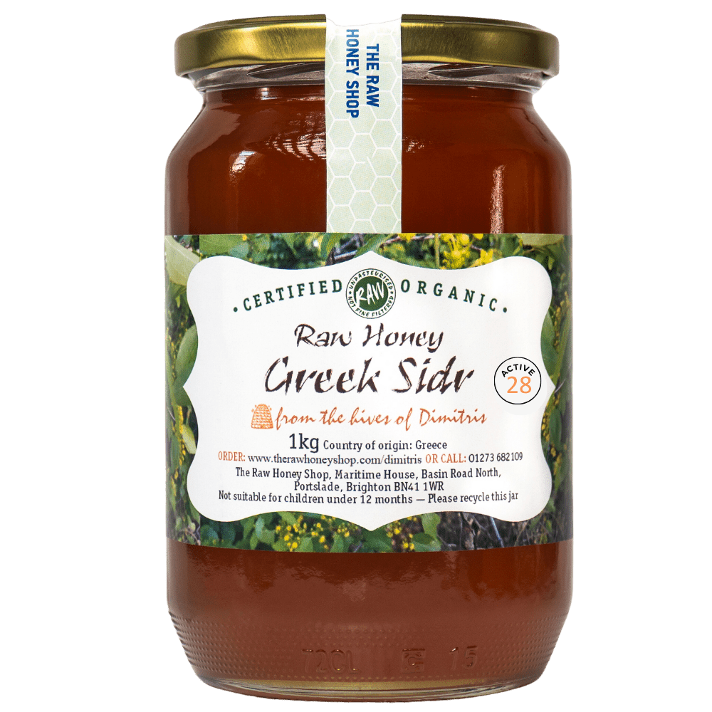 Large labelled glass jar containing 1kg of dark raw organic Greek sidr honey.