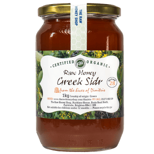 Large labelled glass jar containing 1kg of dark raw organic Greek sidr honey.