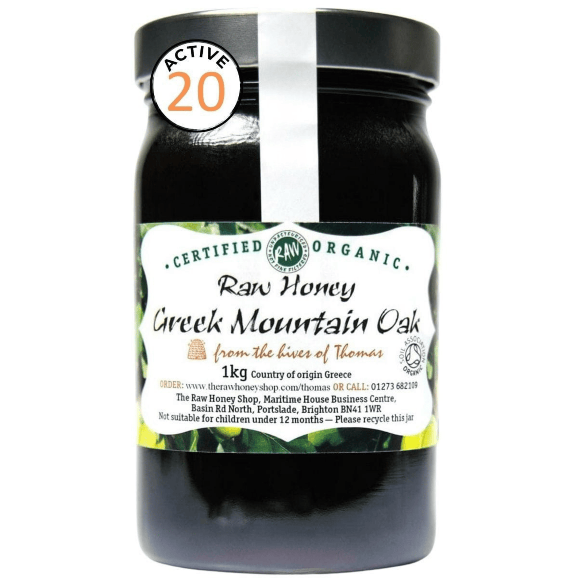 Jar of raw honey from Greek Mountain Oak with a label on a white background