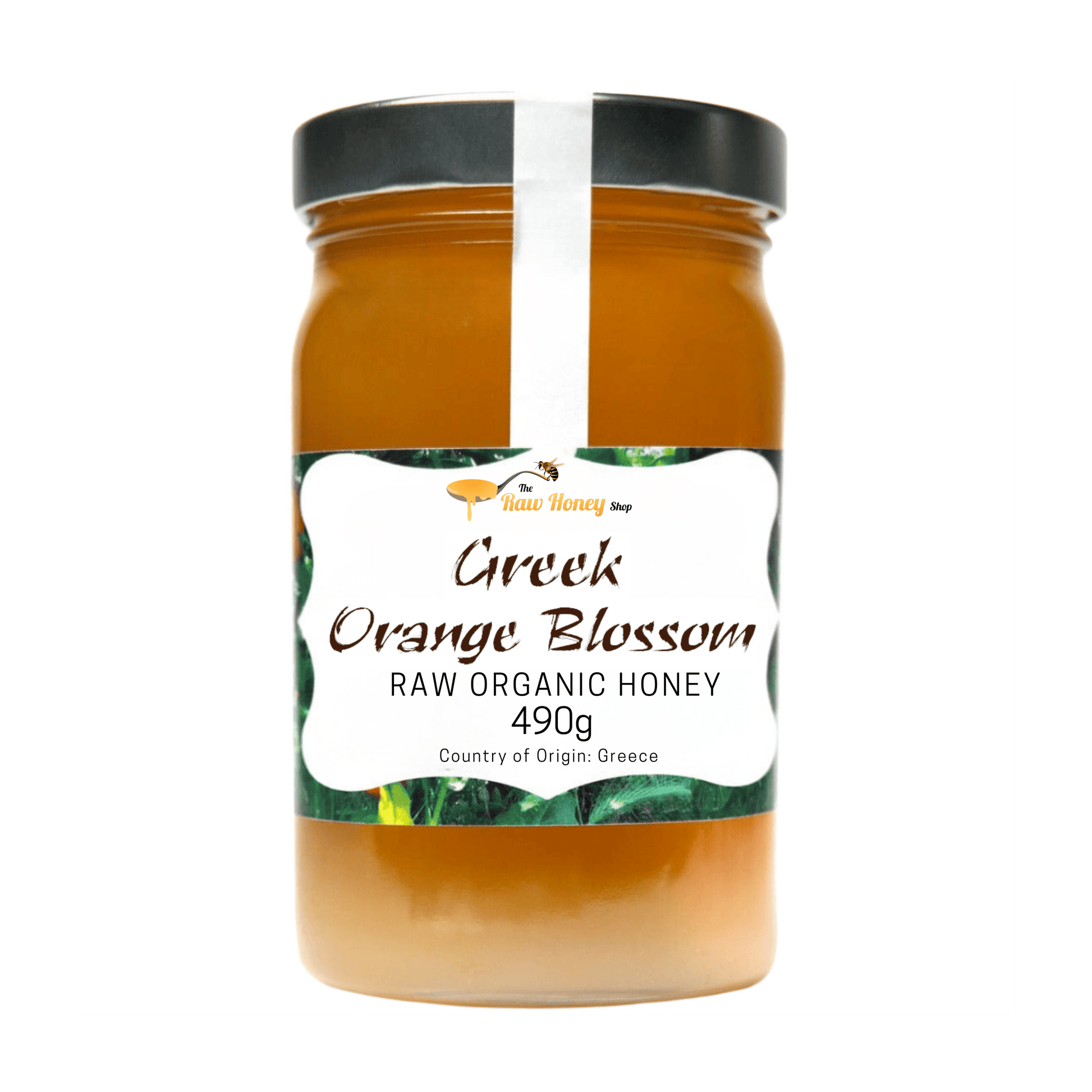 A jar of Greek Orange Blossom Raw Organic Honey from The Raw Honey Shop, featuring a black lid and a white label with green accents, set against a plain white background.