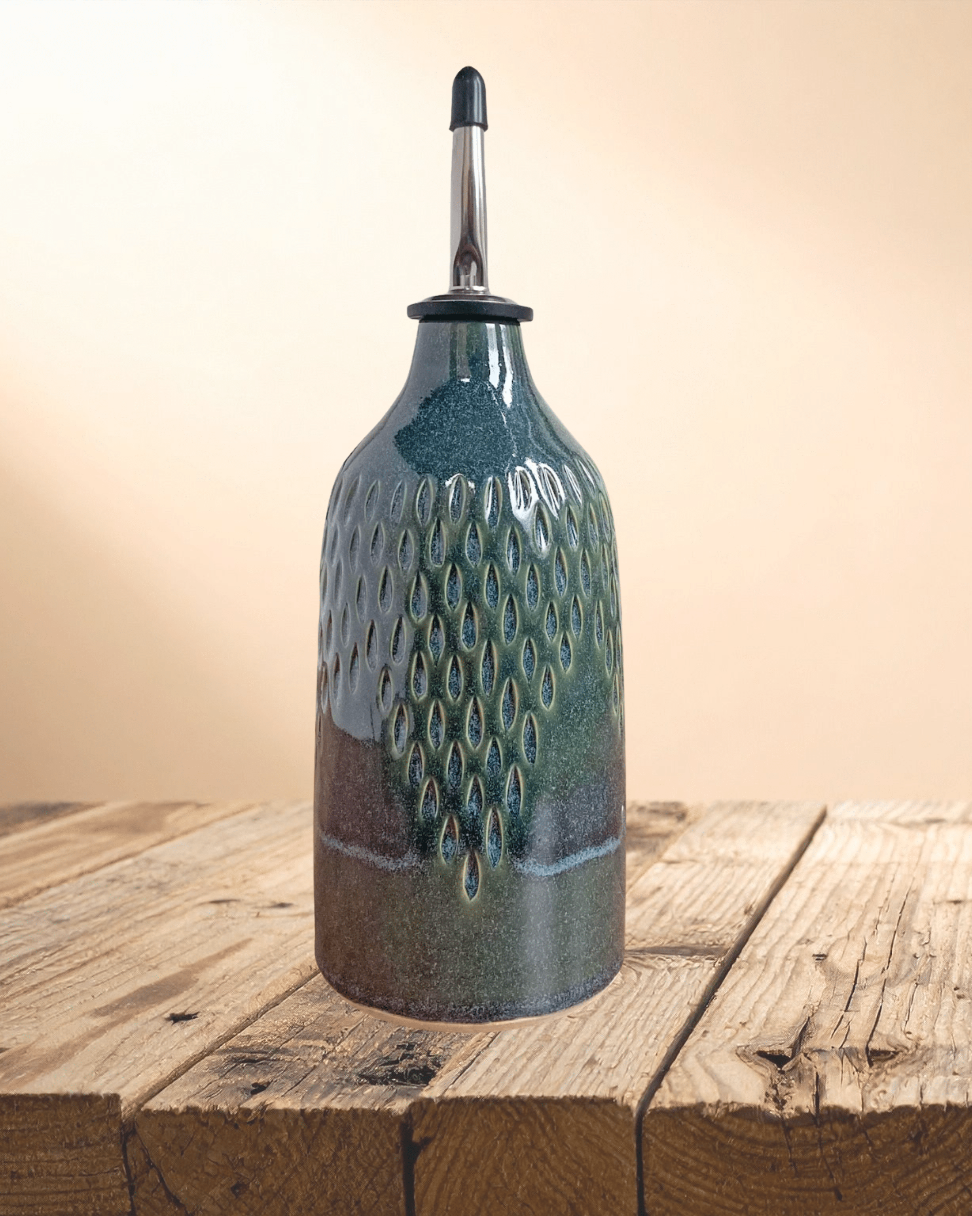 Decorative ceramic bottle with textured design on a wooden surface