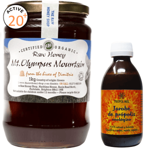 Jar of Mount Olympus Mountain raw honey and a bottle of Propol-Mel propolis syrup on a white background.