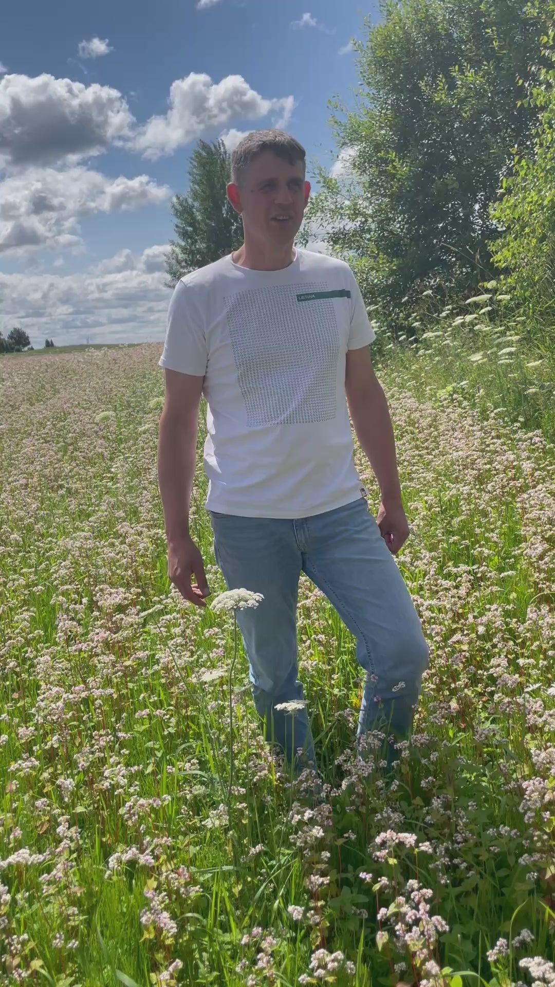 Video of beekeeper Laimonas standing in a field in Lithuania of flowering Buckwheat.
