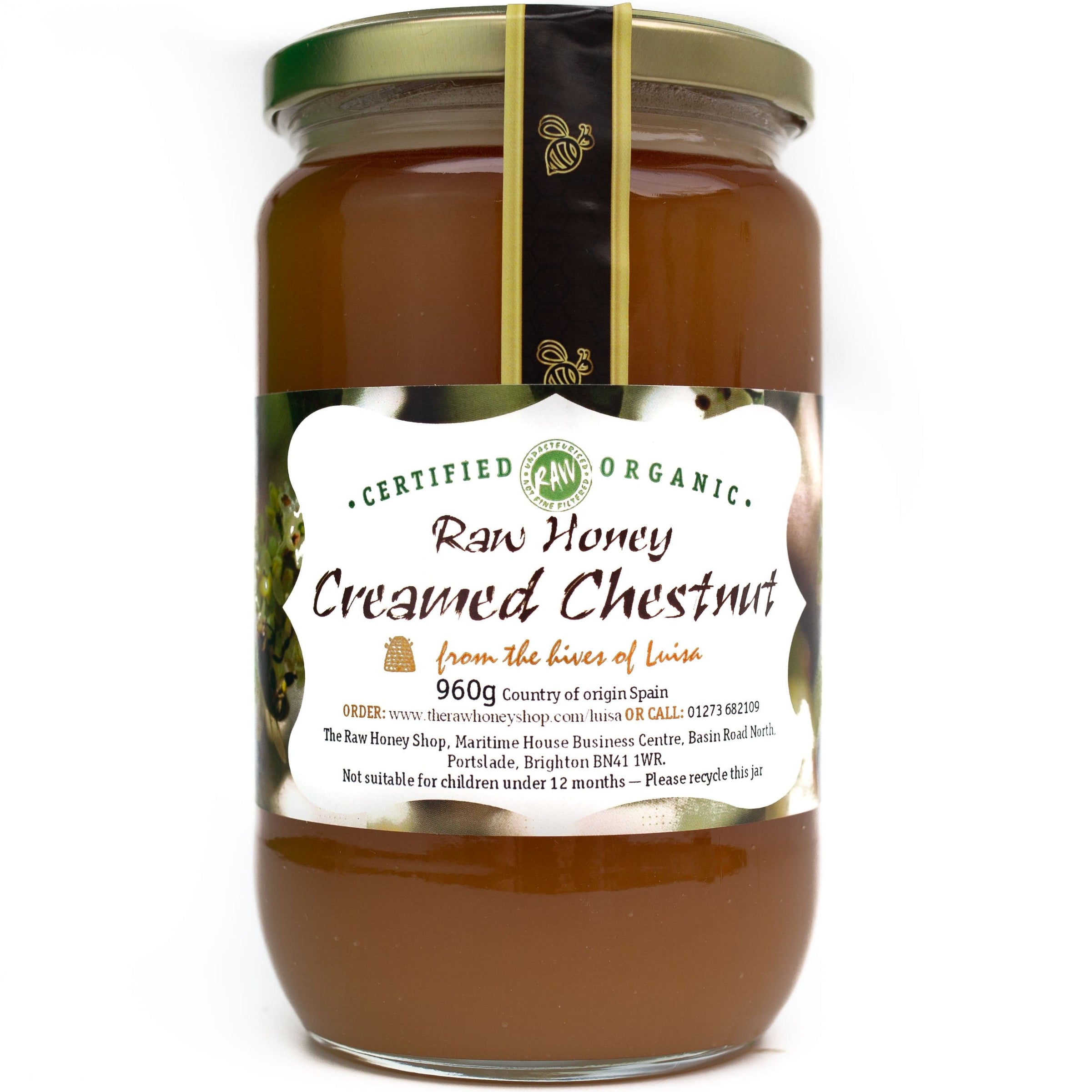 Large glass jar containing 960g of dark raw organic creamed chestnut honey.
