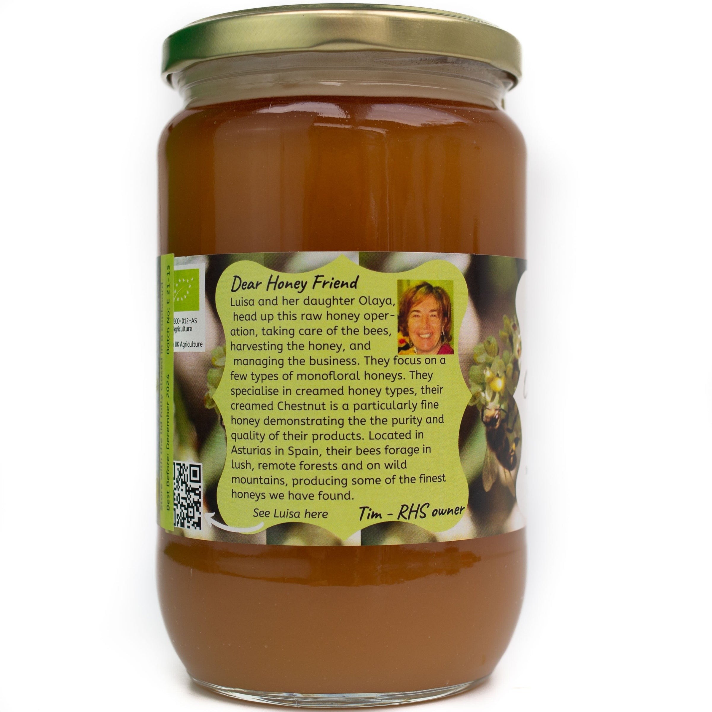 Jar of golden coloured honey showing label on reverse