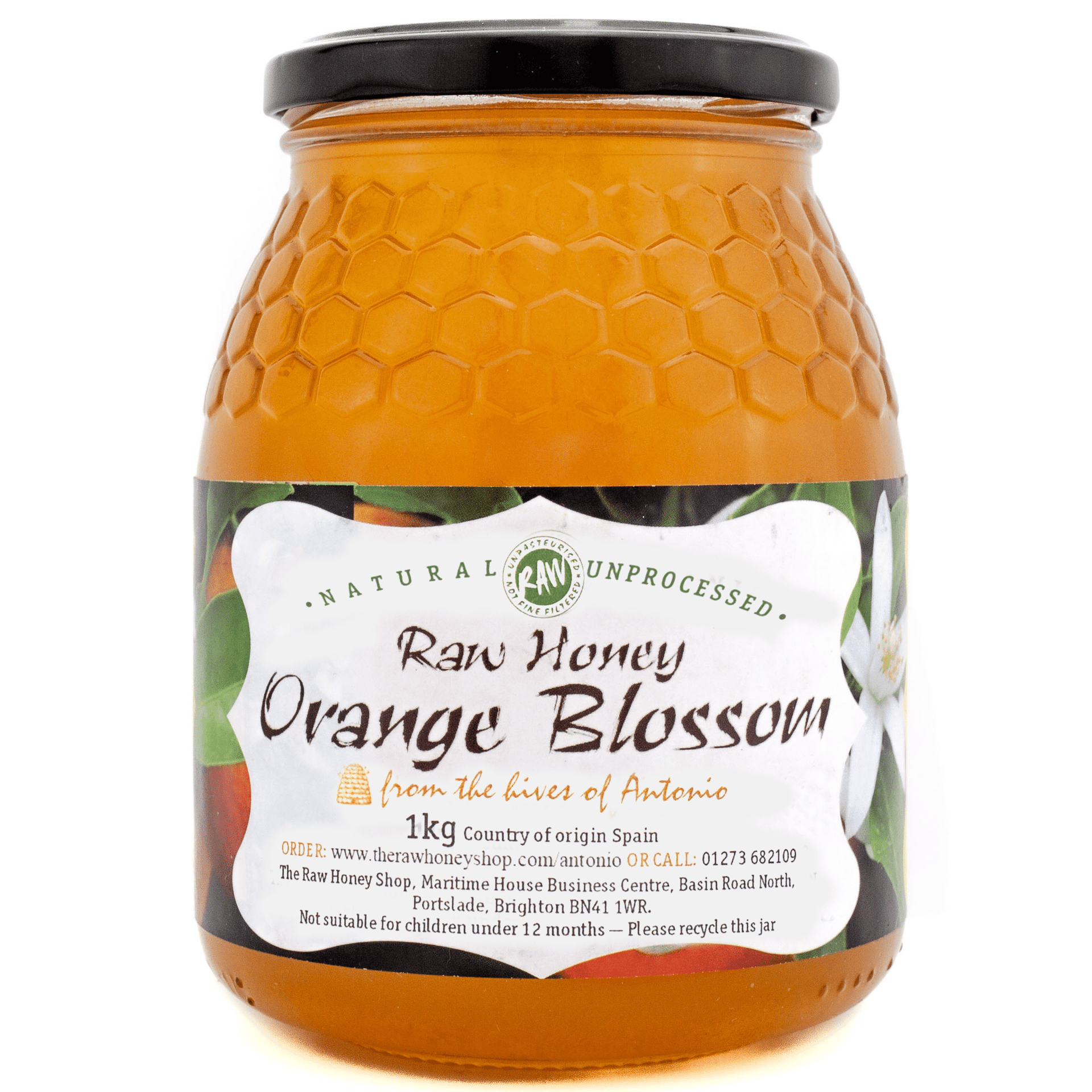 Large labelled glass jar containing 1kg of raw orange blossom honey.